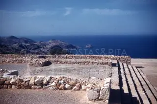Stone wall foundations and a paved platform at Vouni Palace overlooking the sea