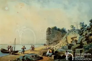 Figures load stone blocks onto a boat on a beach, with a ruined wall and the sea beyond
