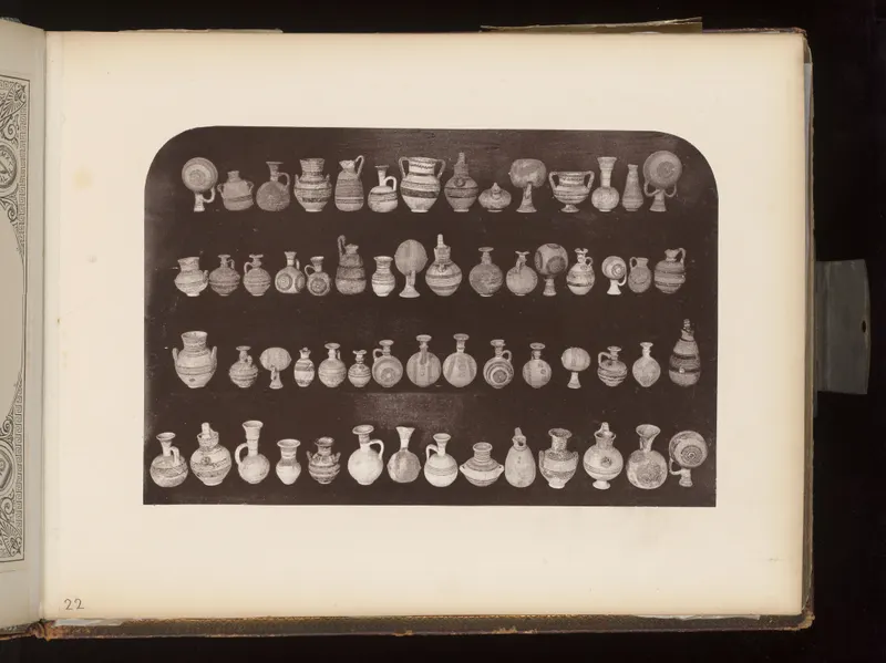 Four rows of small painted pottery vessels, jugs, juglets and bowls, set out on a dark ground.