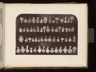 Painted terracotta vessels in four rows