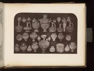 Terracotta jugs, juglets and bowls in rows