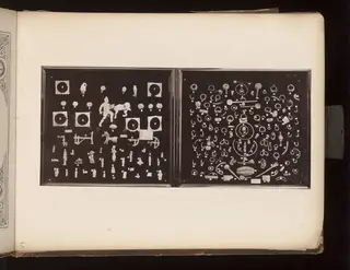 Terracotta figurines, jewellery and metal objects on two boards