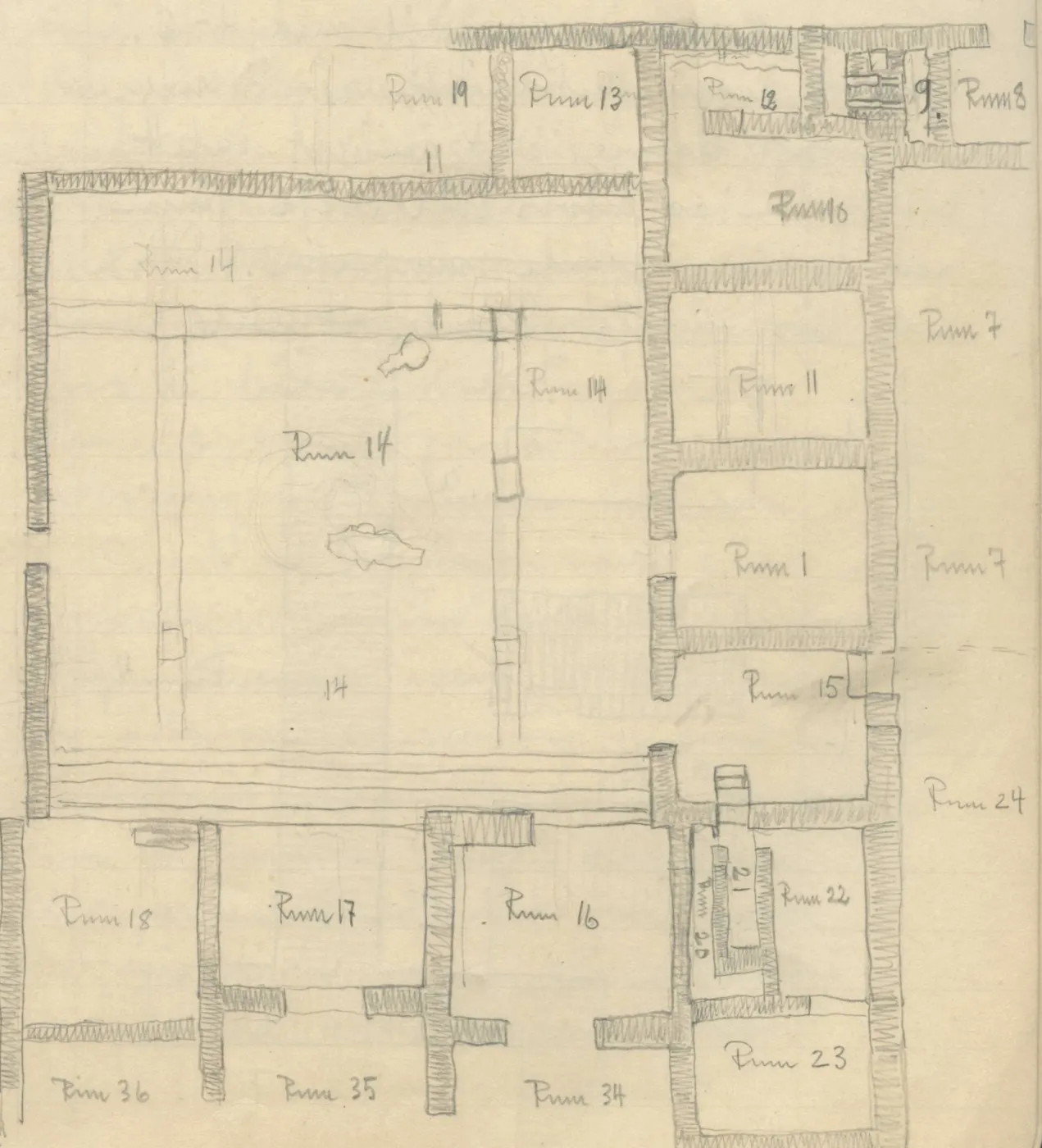 Architectural plan of a multi-room building with hatched walls and a north arrow