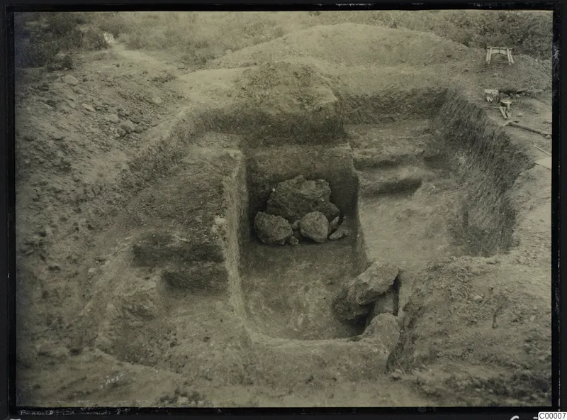 Excavated dromos of Tomb 303 at Vrysi tou Barba, Lapithos, with stones in the cut and tools at the edge
