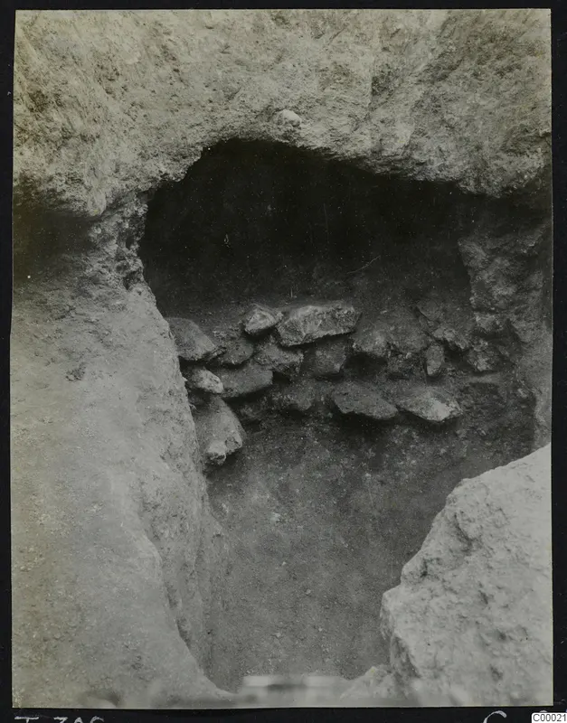 Tomb 306 at Lapithos, Vrysi tou Barba, during excavation, showing the opening of the tomb chamber with stones inside