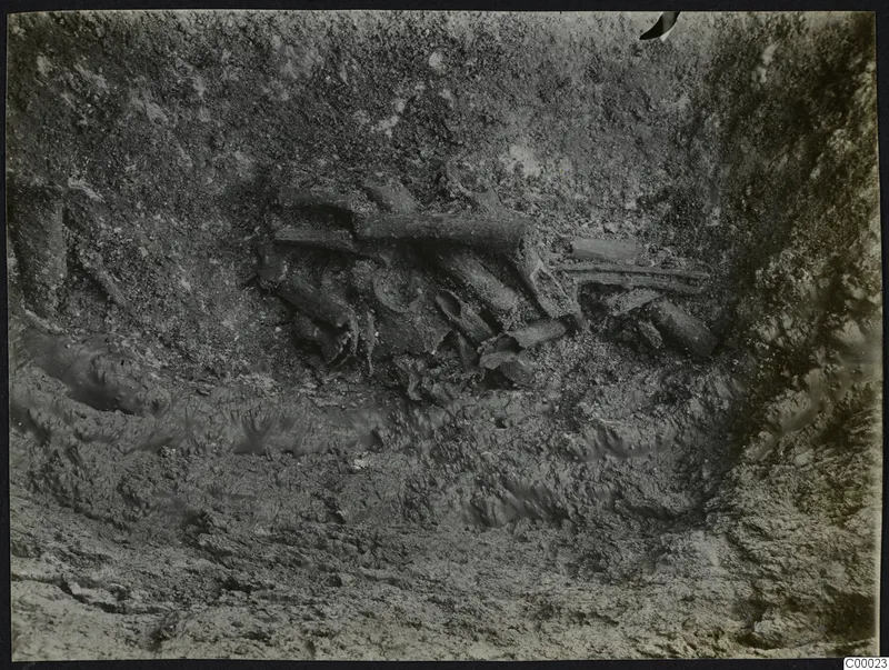 Excavation at Vrysi tou Barba, Lapithos, with a skeleton lying in the soil of a pit