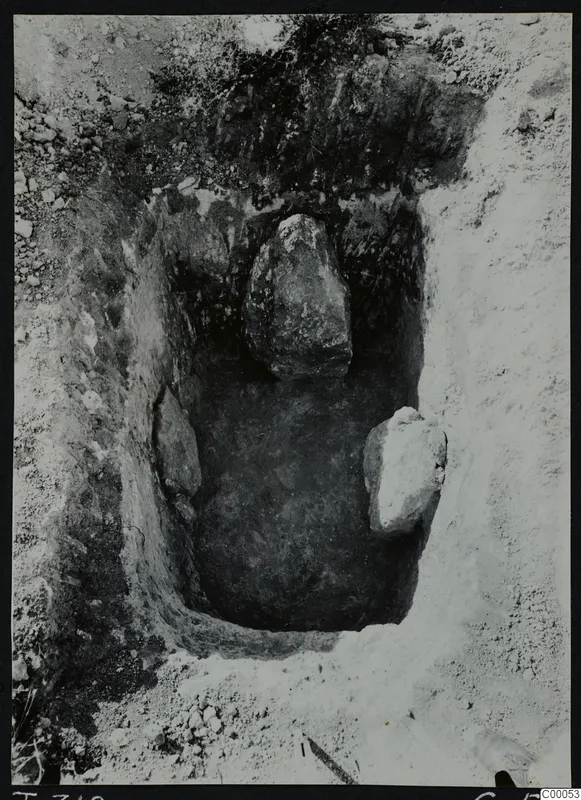 Tomb 319 at Lapithos, Vrysi tou Barba: tomb chamber during excavation, with two large stones inside.