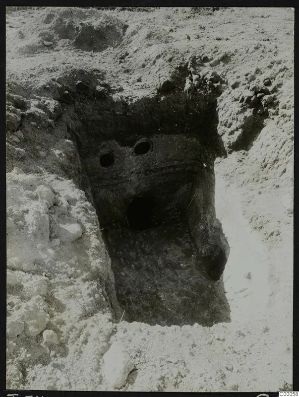 Tomb 311 at Lapithos, Vrysi tou Barba: excavated tomb chamber with two round openings in its wall face