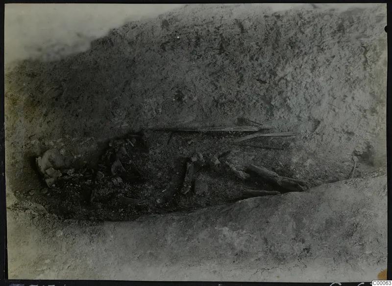 Tomb 313 B at Lapithos: skeleton and objects in the tomb chamber during excavation