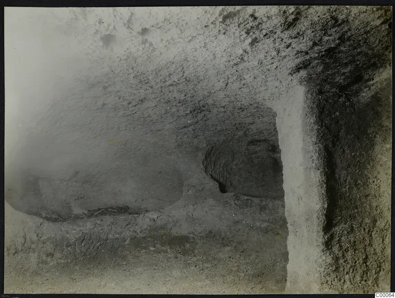 Interior of rock-cut Tomb 321 b at Vrysi tou Barba, Lapithos, with loose debris on the uneven floor