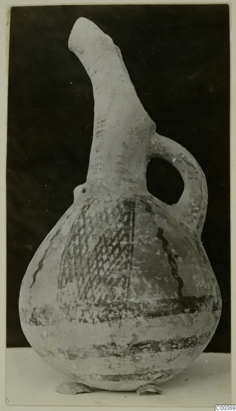 Pottery White Painted I - II vessel: a jug with a tall spout-like neck, loop handle and dark painted bands and lattice pattern