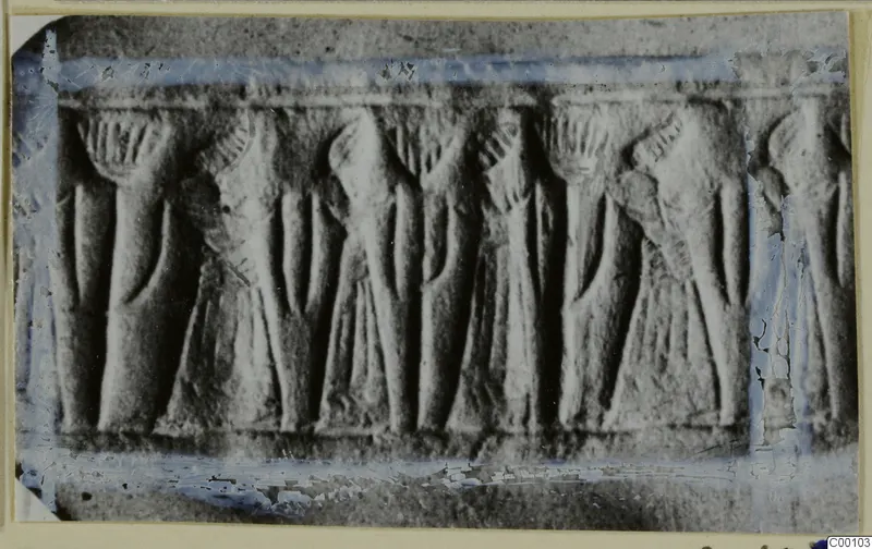 Carved stone seal showing a horizontal band of repeated standing figures in relief