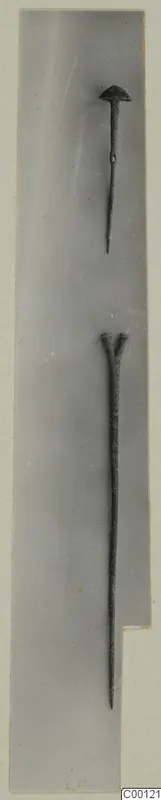 Two bronze tools from the Vrysi tou Barba tombs at Lapithos, one with a rounded head and one with a forked head