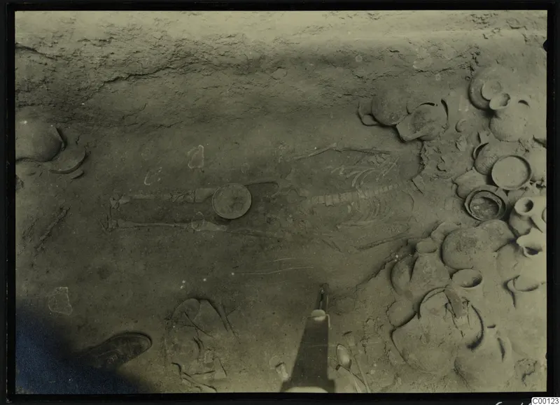 Tomb 417 at Lapithos Kastros: skeleton and pottery vessels in the tomb chamber during excavation