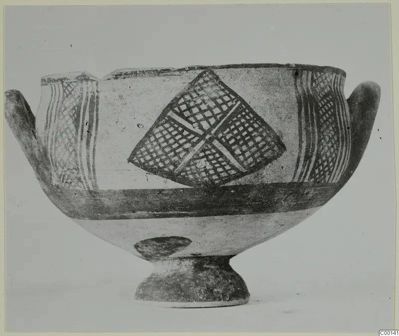 White Painted I bowl from Lapithos, with cross-hatched lozenge and vertical bands painted in dark on a light ground