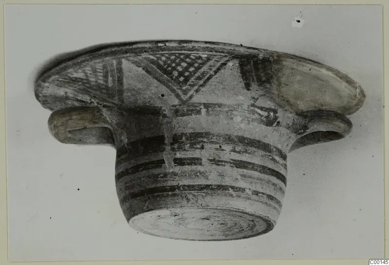 Pottery Bichrome I bowl from the Kastros tombs at Lapithos, seen from the side with painted bands and patterned rim