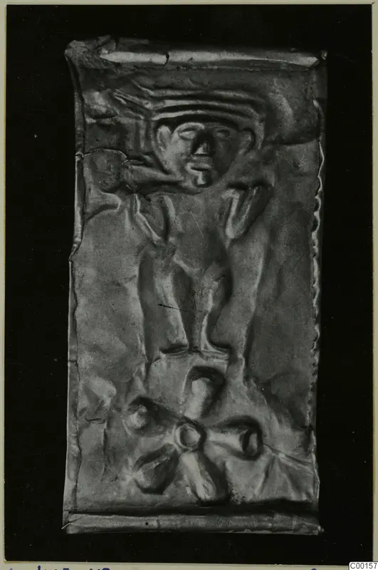 Embossed thin metal sheet with a human face and a figure, find from Lapithos