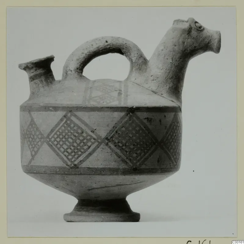White Painted I jug, askos, from the Kastros tombs at Lapithos, with an animal-head spout and painted diamond lattice bands