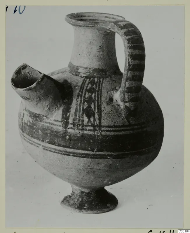 Pottery White Painted I jug with side spout, strap handle and painted bands, from the Kastros tombs at Lapithos