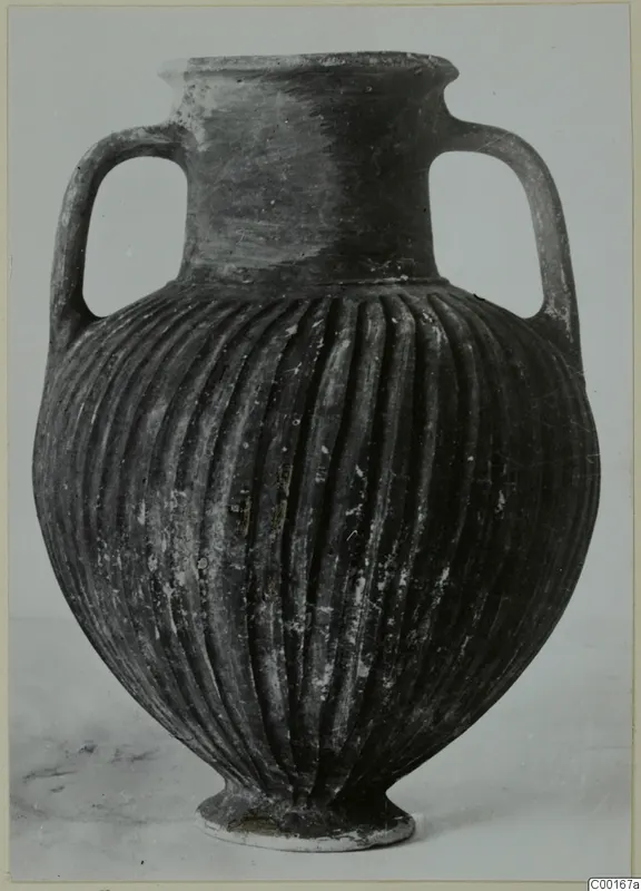 Black slip ware amphora with two handles and vertical fluting, from the Kastros tombs at Lapithos