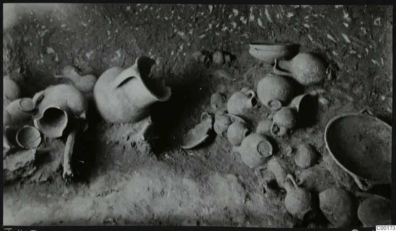 Tomb 403 at Lapithos: pottery vessels lying on the floor of the tomb chamber during excavation