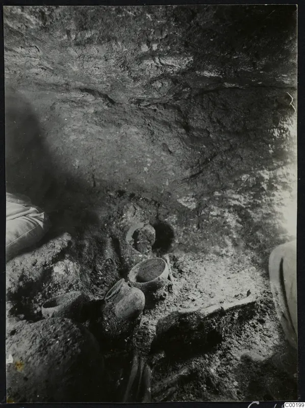Tomb chamber at Lapithos, Vrysi tou Barba, with pottery vessels on the floor during excavation
