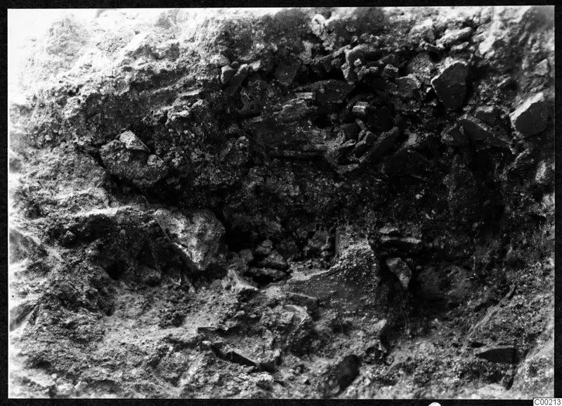 Excavated soil face with broken stones and rubble, at the theatre at Soli