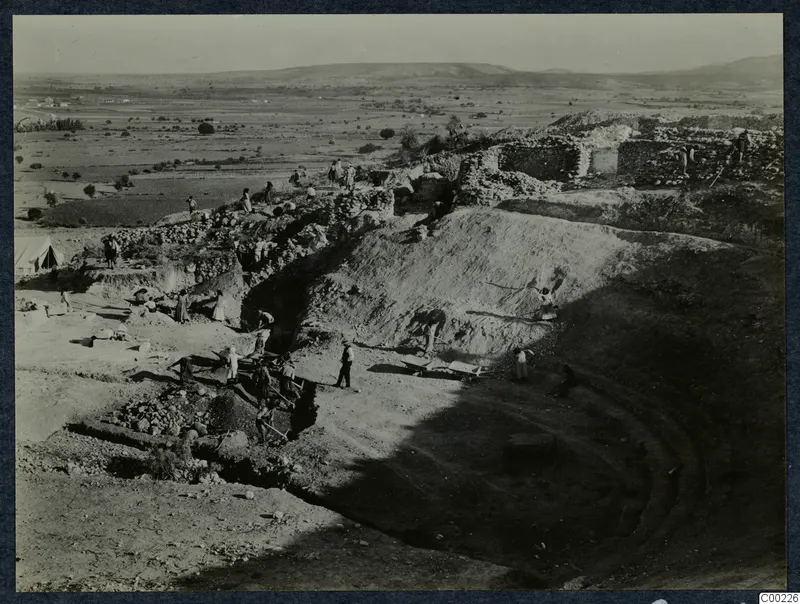 Excavation of the theatre at Soli, workers clearing the orchestra, seen from the west