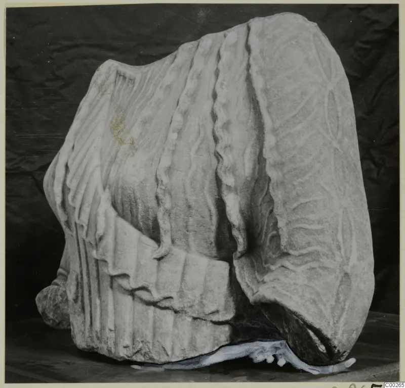 Marble sculpture fragment with carved drapery, found at Galini