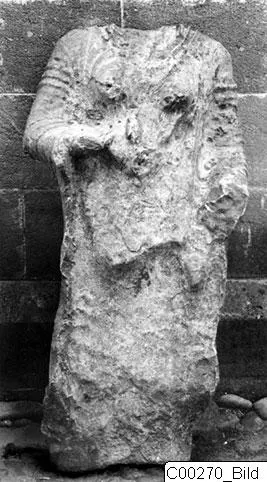 Headless limestone statue from Vouni, a standing figure with arms bent and hands held in front of the body