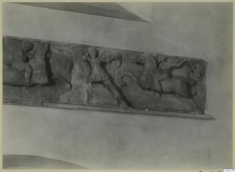 Marble relief from Soli with fighting figures, one carrying a round shield