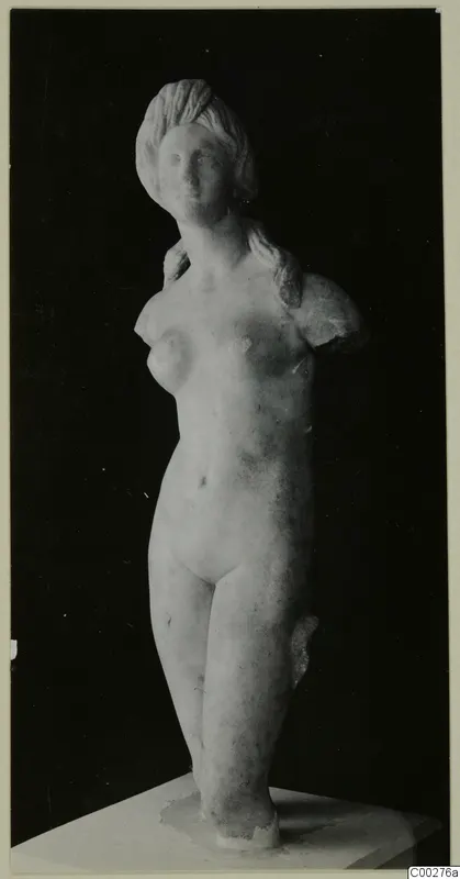 Nude marble statue, probably of Aphrodite, standing on a square plinth with both arms broken off
