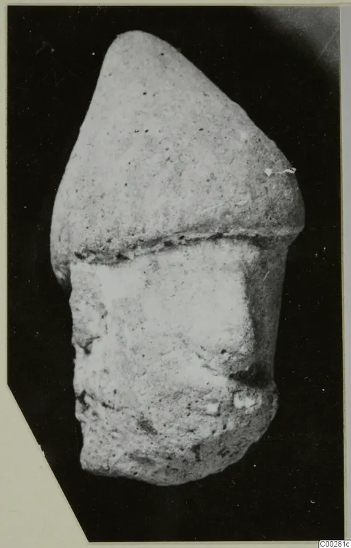 Terracotta head from Soli, with a domed upper part above a broken lower section