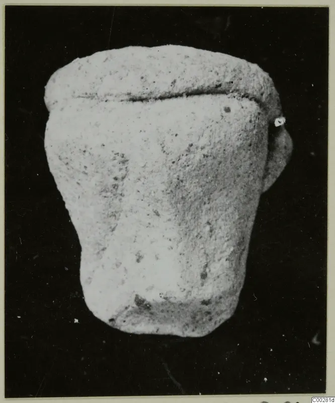 Terracotta Minor Plastic 3, a small pale squat object with a groove near the top and a short projection on one side