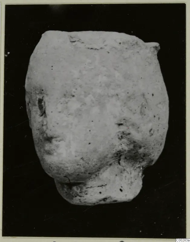 Terracotta fragment, Minor Plastic 2, from Soli, photographed against a dark background