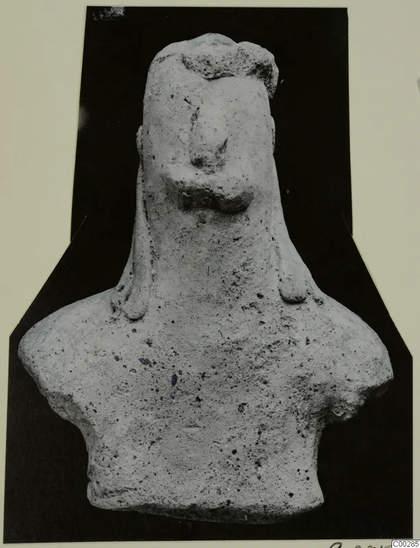 Terracotta figurine of a head and upper body with long side locks, shown from the front