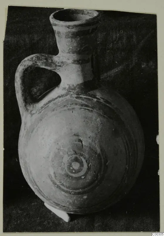 Pottery Bichrome II jug from Lapithos, Kastros tombs, with one handle and concentric painted rings on the body