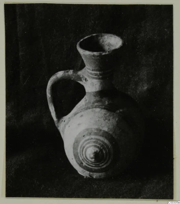 Pottery Bichrome II jug from Lapithos, with a loop handle and concentric circles painted on its body