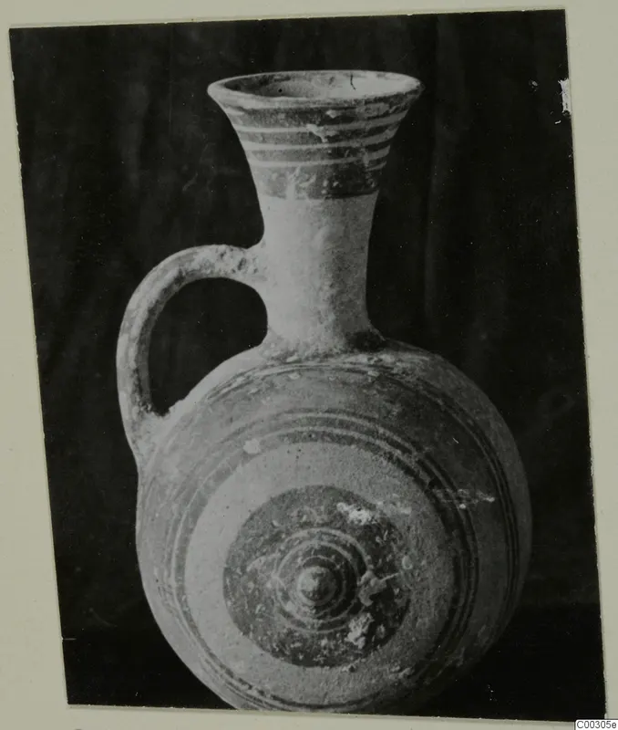 Pottery Bichrome II single-handled vessel from Lapithos, Kastros tombs, with banded neck and concentric circles on the body