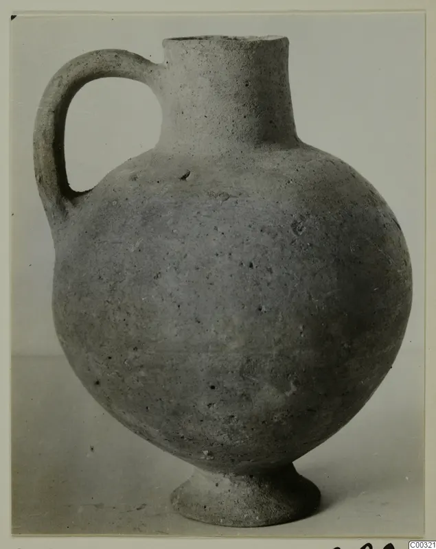 Plain pale jug with a single handle, tall neck and ring foot, from Lapithos