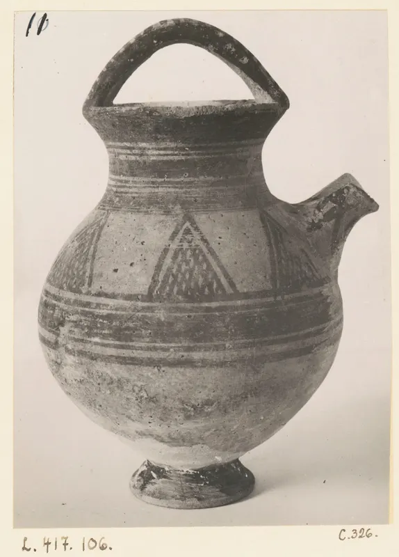 White Painted I jug with a strap handle, side spout and painted bands and triangles
