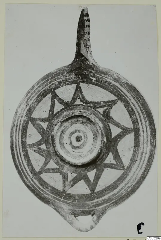 Pottery lamp with a long nozzle and star-shaped painted bands on its disc, from Lapithos Kastros tombs