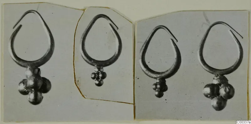Four gold earrings, each a teardrop-shaped loop with a cluster of round beads hanging from its base, shown in photographs.