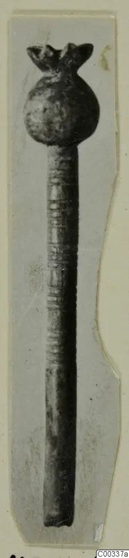 Bone object with a pomegranate or poppy bud top, from Lapithos