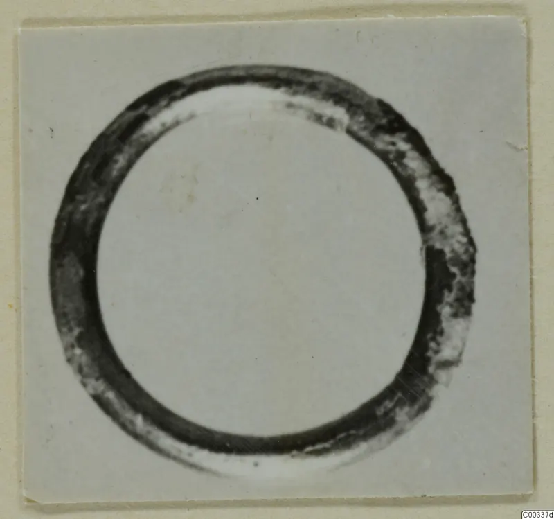 Gold ring from the Kastros tombs at Lapithos, shown close up on a pale background