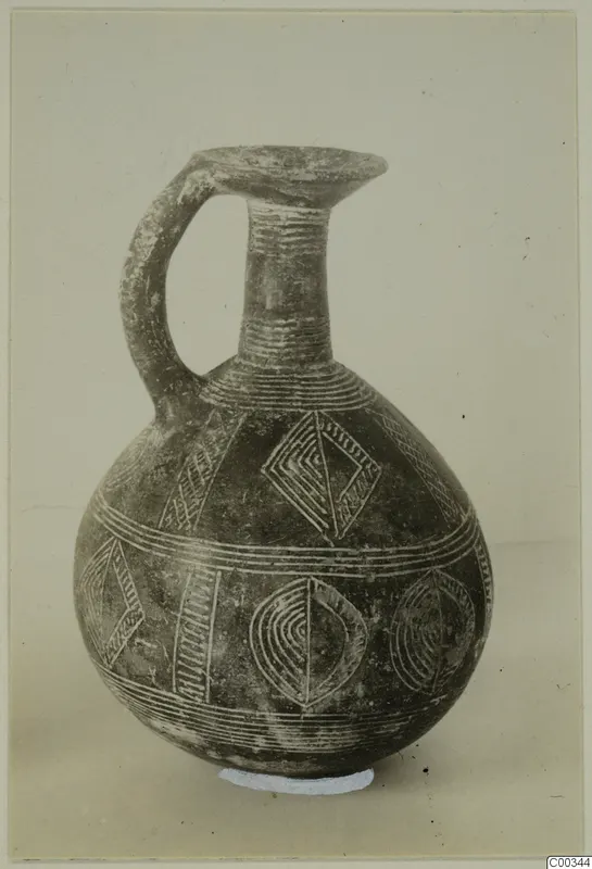 Red Polished II jug from Lapithos with incised bands and lozenge motifs filled with light pigment