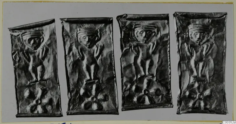 Four thin embossed metal plates in a row, each showing a standing figure with raised arms above a rosette motif.