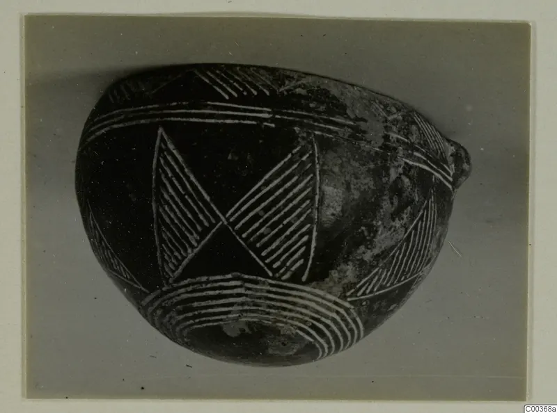 Dark polished bowl from Lapithos with incised hatched triangles and bands of lines.