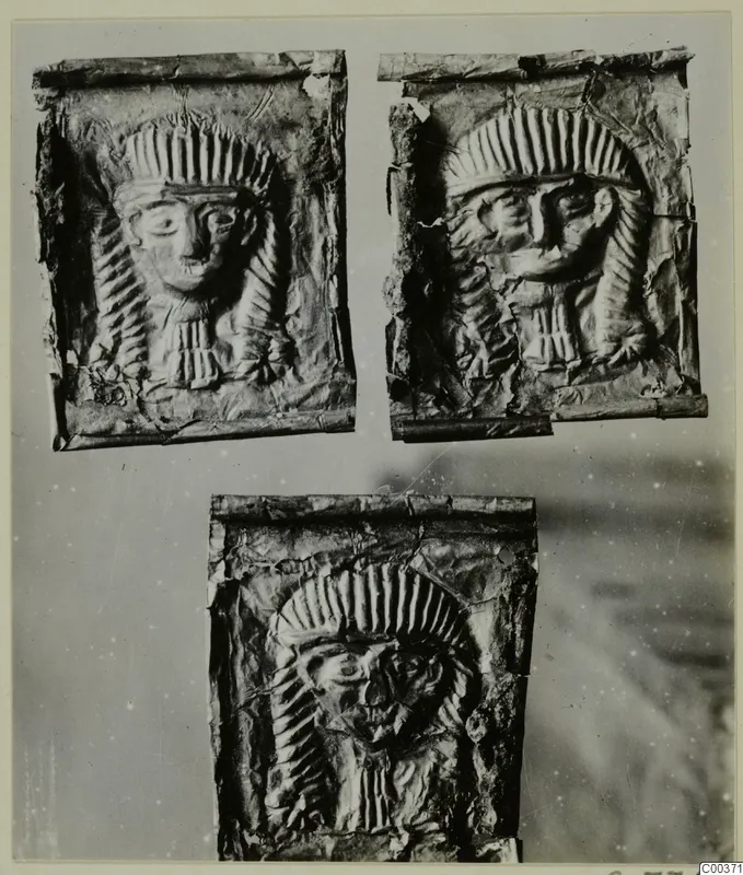 Three embossed metal plaques showing frontal faces framed by radiating headdresses, from Lapithos Kastros