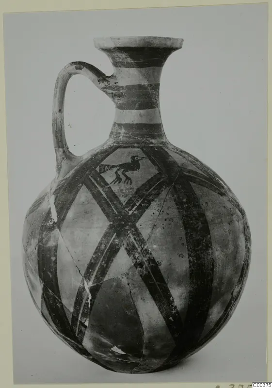 Bichrome wheel-made jug from Milia with banded neck, diagonal lattice pattern and a painted bird on the body